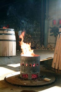 The flames used to achieve the as the barrel is shaped, François Frères cooperage, Saint Romain, France / Photo copyright Jean-Pierre Muzard, courtesy Vins de Bourgogne