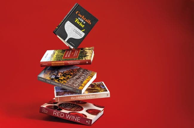 Stack of wine books on a red background