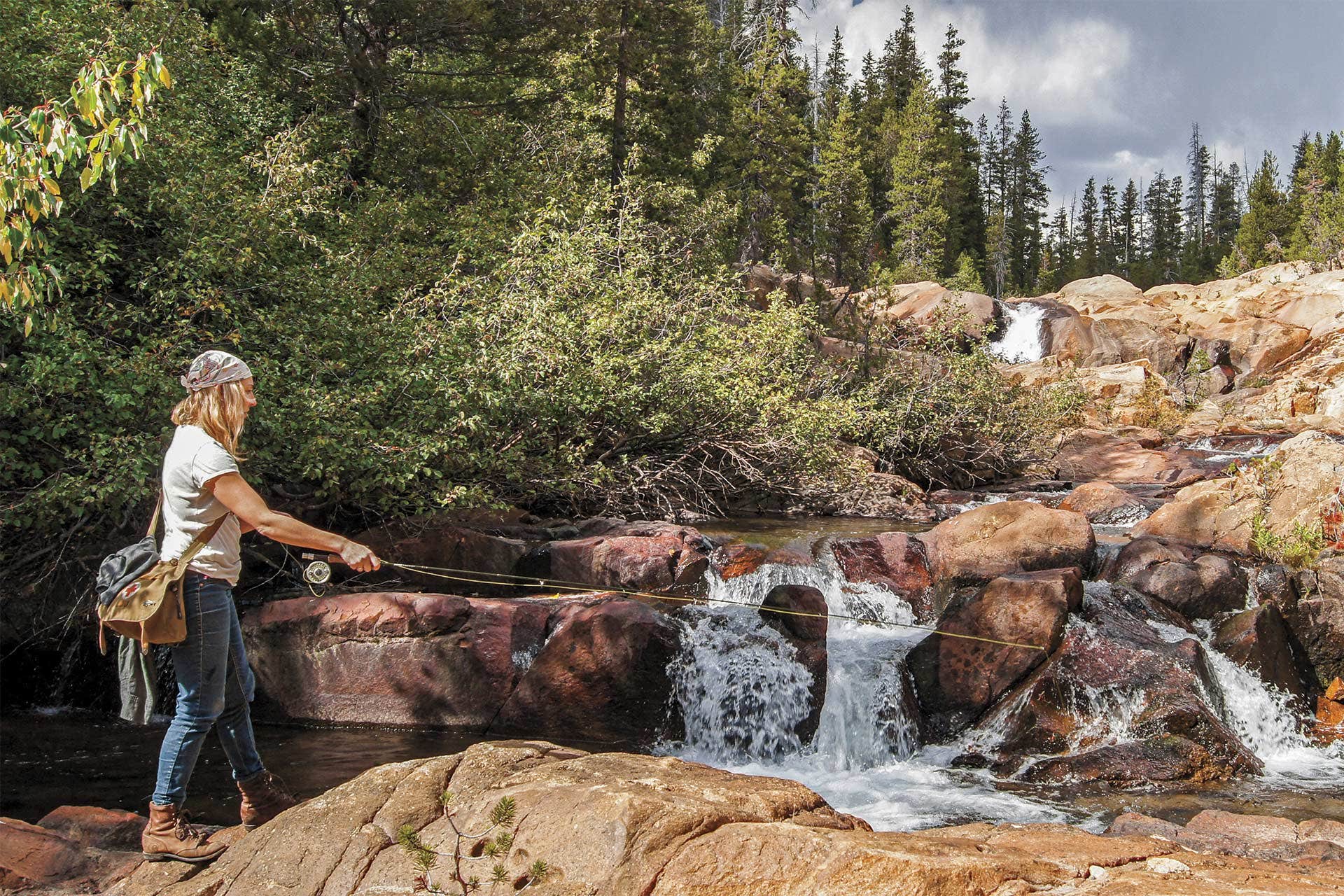 Lexi Boeger casts for fish in a high-country creek 