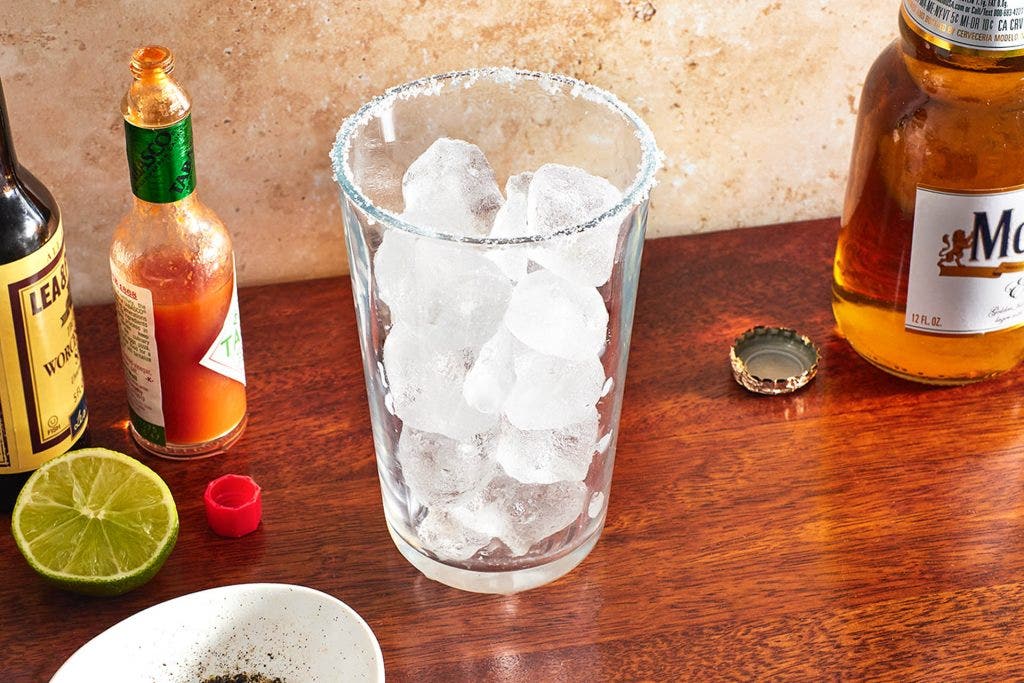 ice in a pint glass with a salted rim
