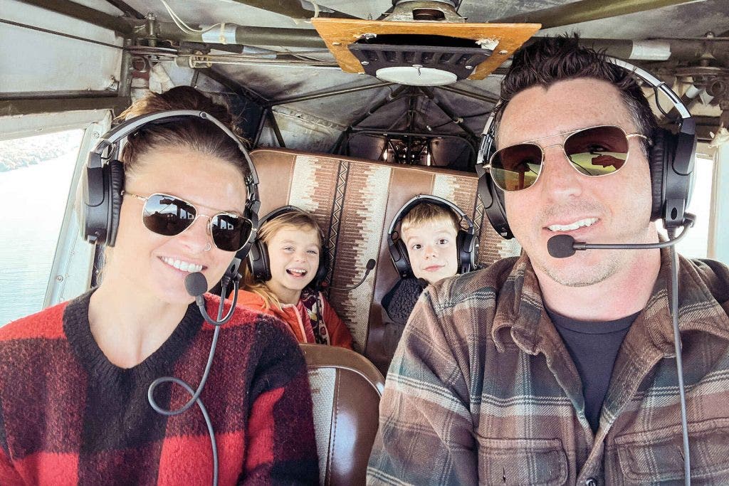 family flying in airplane over Lake Michigan